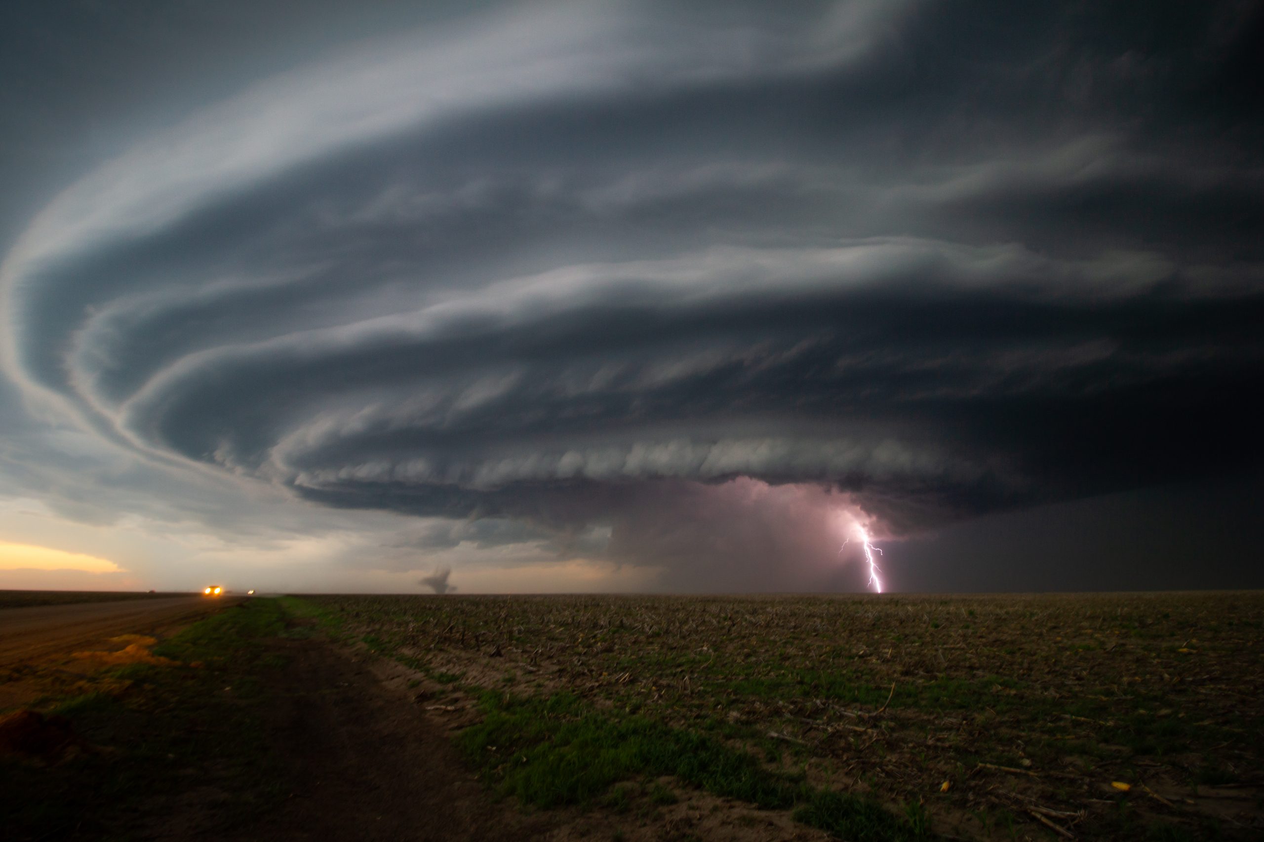 The Mothership! A large supercell thunderstorm with lightning and a small tornado over fields in Kansas, U.S.A., June 2019 (pic: @fitzpatricknoel). This was one of the most impressive and beautiful storms the team encountered on their trip.